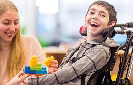 Support worker chatting with a participant at home